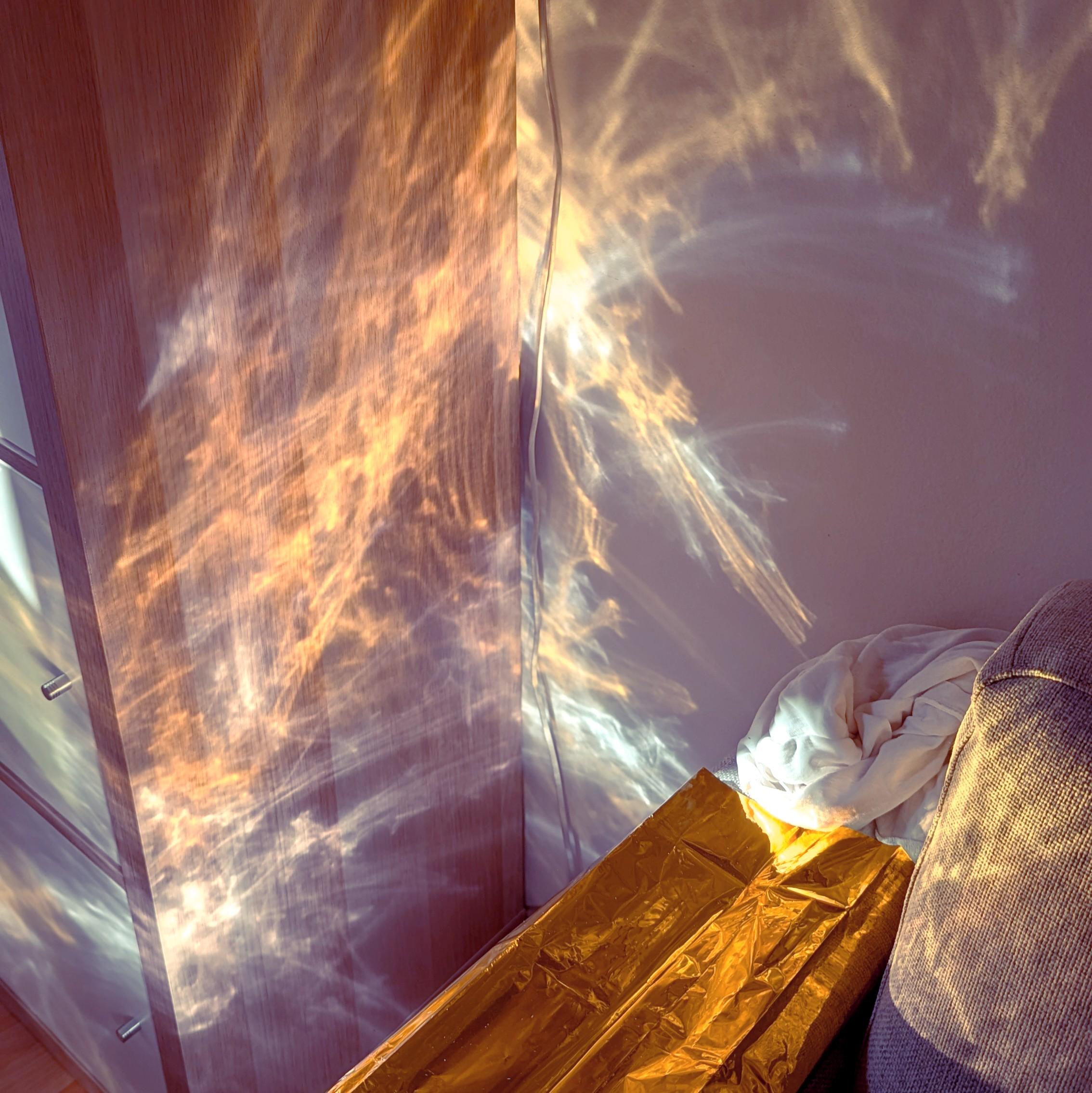 Textures created by sun light reflected on an irregular surface